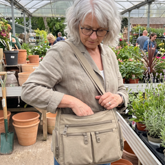 Kia crossbody bag in khaki at the garden centre