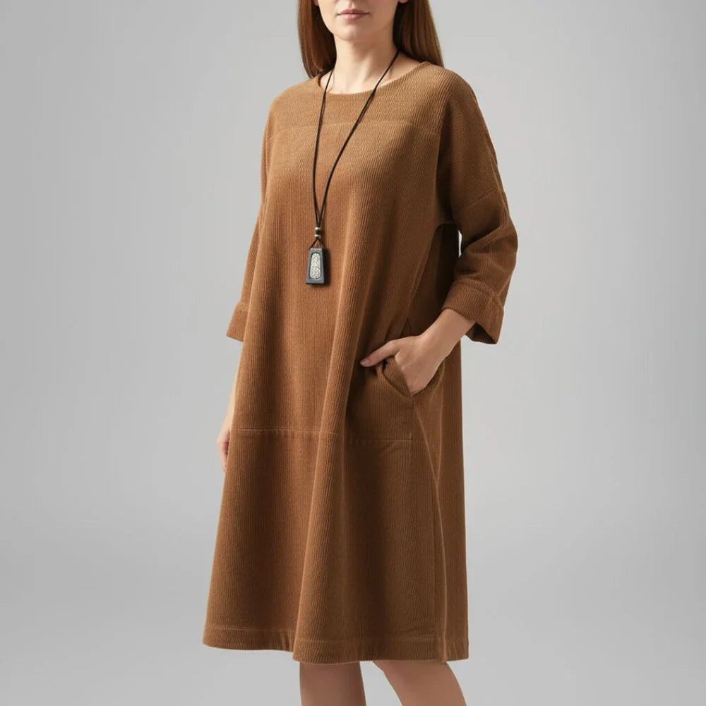 Amy corduroy midi dress in brown on the model