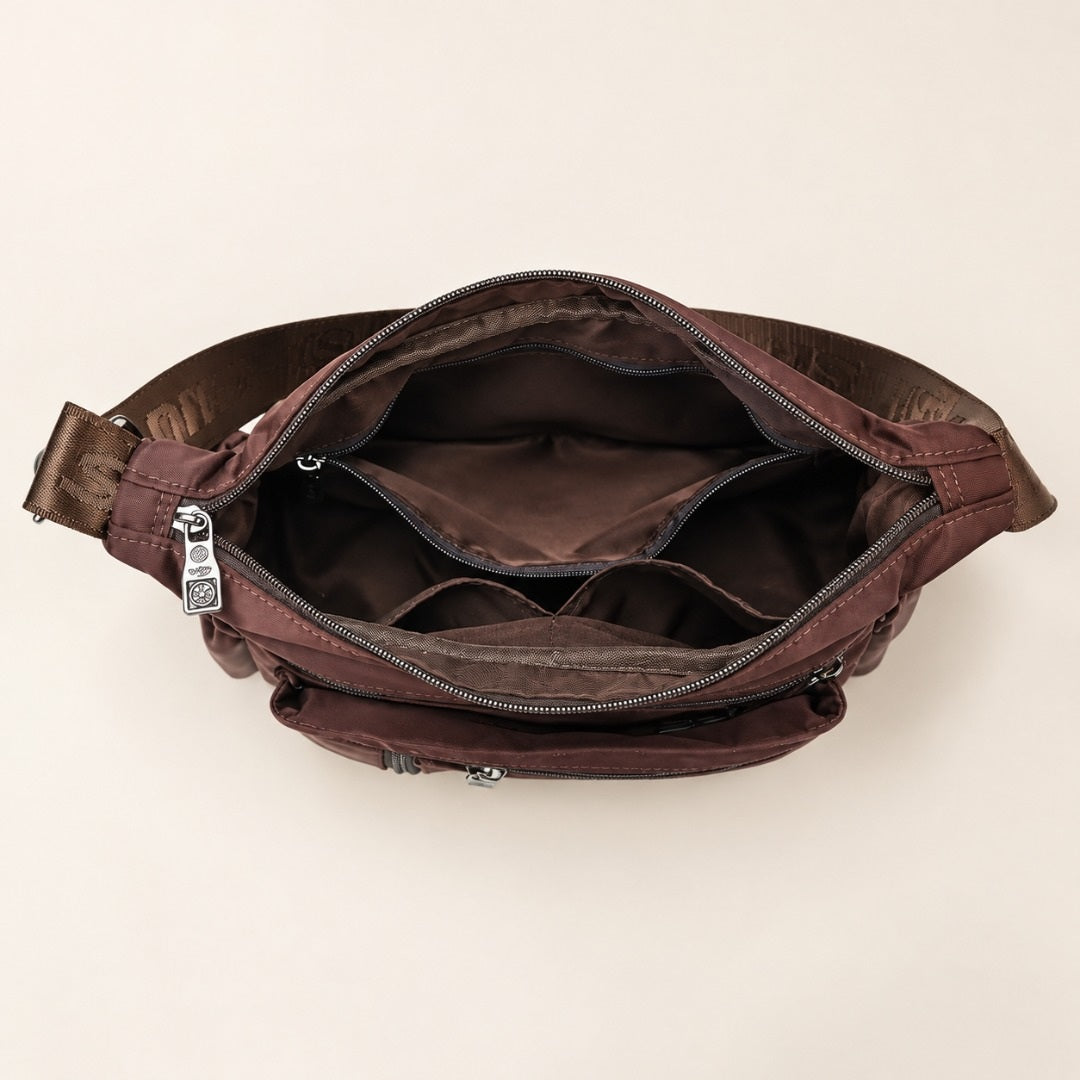 Inside the Iris crossbody bag: compartments and zip pockets