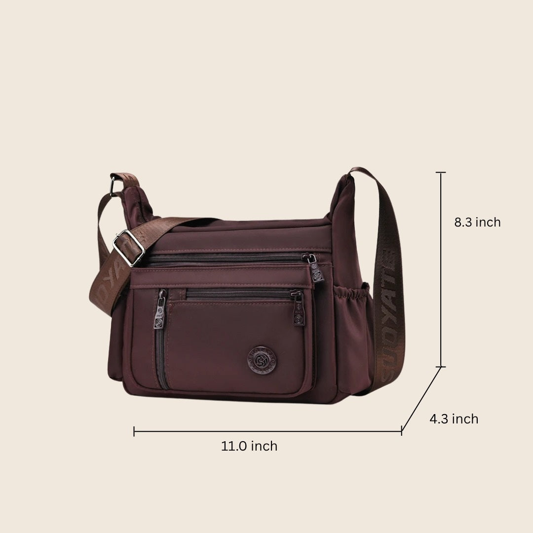 Iris crossbody bag dimensions: 11.0 in wide, 8.3 in high, 4.3 in deep