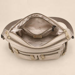 Kia crossbody bag, inside with the zip compartments