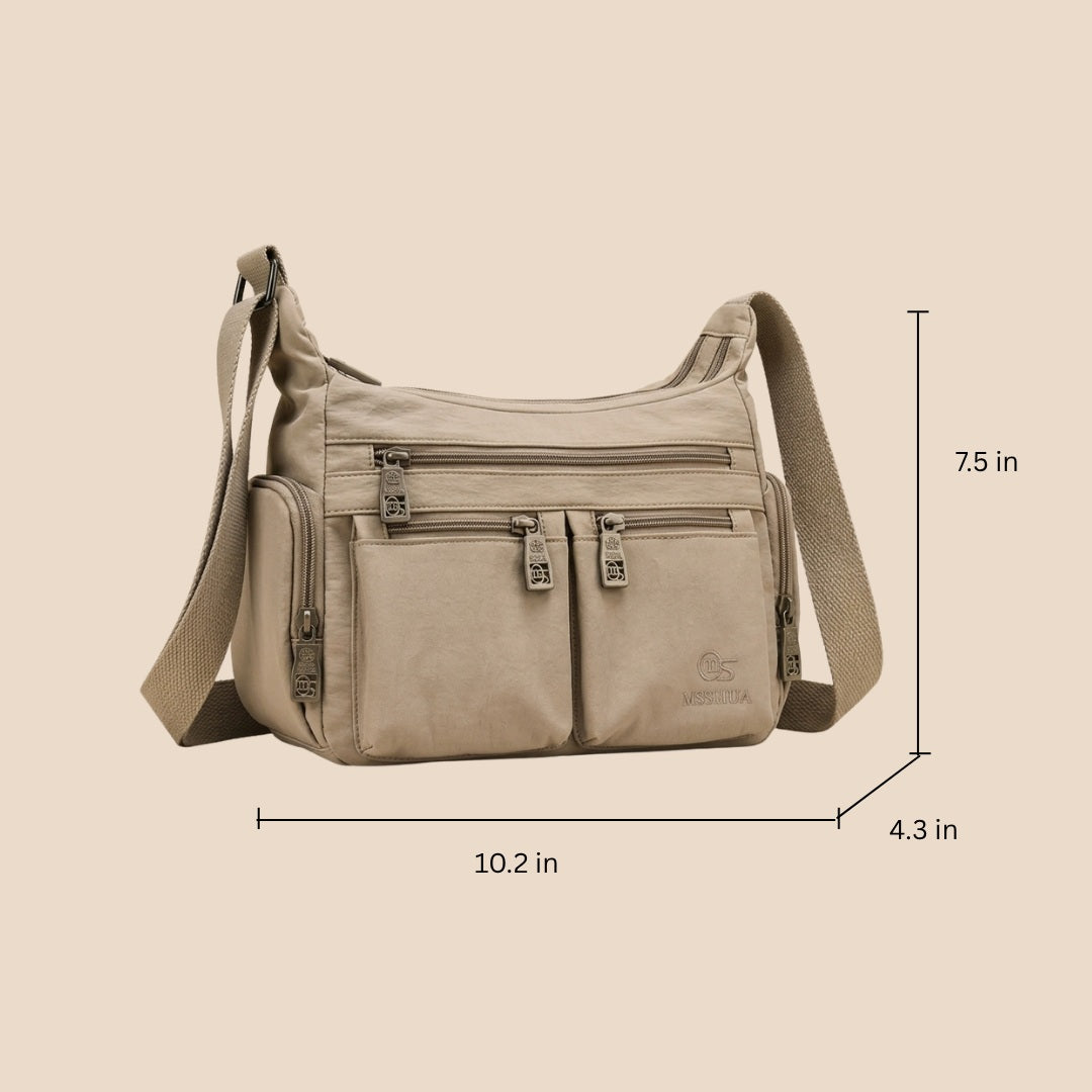 Kia crossbody bag dimensions: 10.2 in wide, 7.5 in high, 4.3 in deep