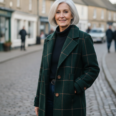 Woman in her sixties wearing the green checked wool coat on a village high street