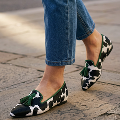 Moccasin — Black and White Cow Print, Green Tassels