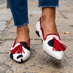 Moccasin — Black and White Cow Print, Red Tassels